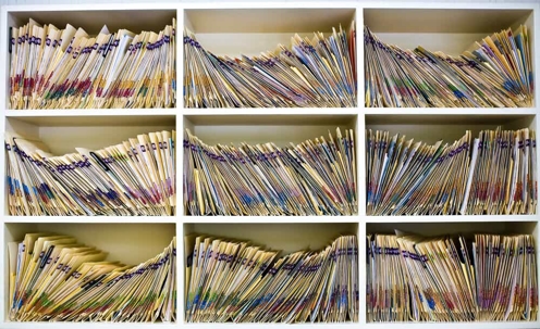 Medical folders on shelf