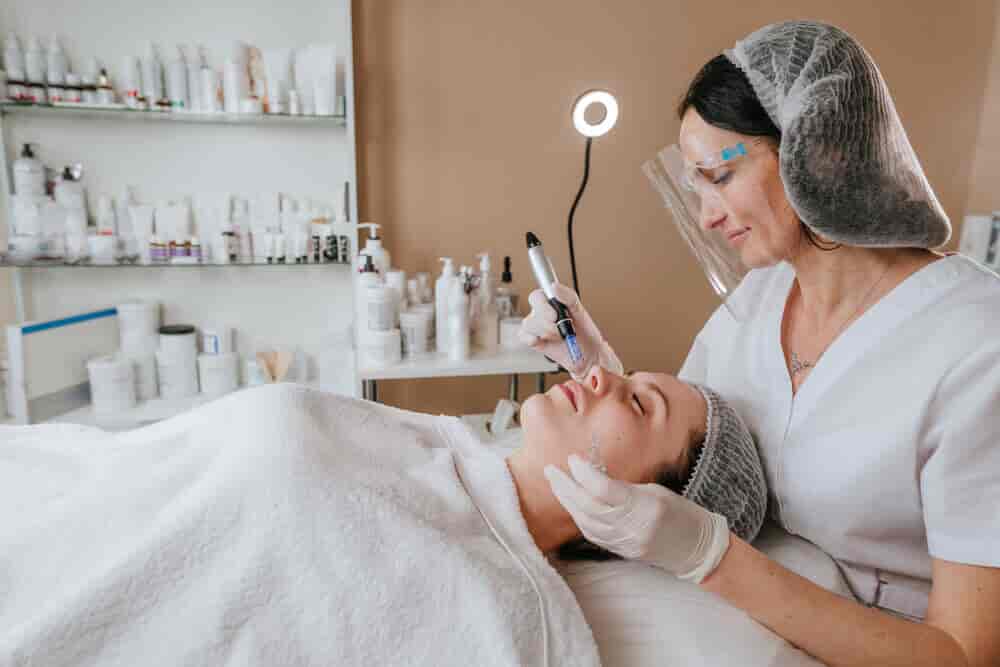 Estheticians working on a client at a Med Spa.